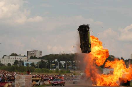 MOSCOW, RUSSIA - AUGUST 13, 2005: Flying burning car on the show stunt MASTER-2005, Tushino airfield