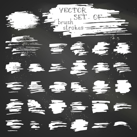 Various chalk brush strokes on blackboard background.のイラスト素材