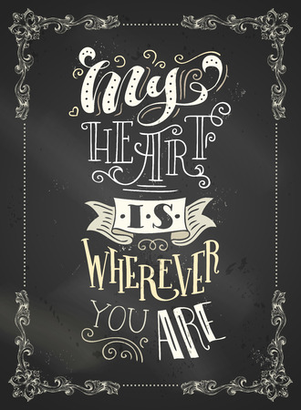 My heart is wherever you are. Chalk handwritten lettering on blackboard background. Vintage frame.のイラスト素材