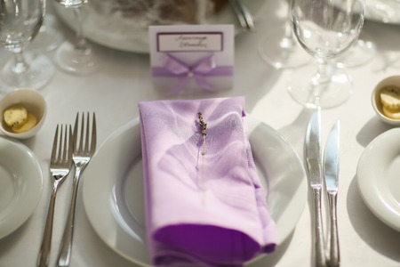 Table setting with lavender flowers, close-up. lilac