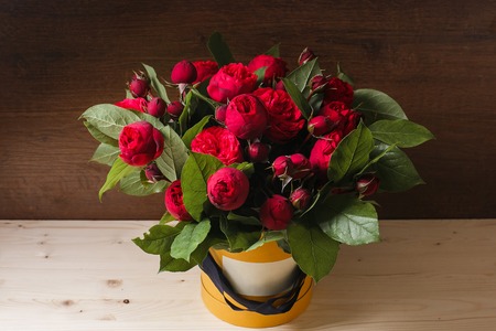 Rich bunch of pink eustoma and roses flowers, green leaf in hand Fresh spring bouquet. Summer Backgroundの写真素材