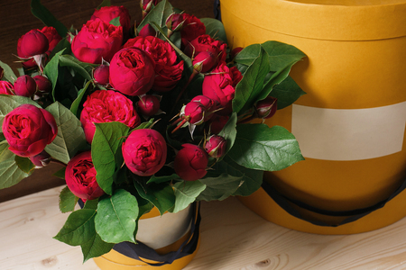 Rich bunch of pink eustoma and roses flowers, green leaf in hand Fresh spring bouquet. Summer Backgroundの写真素材