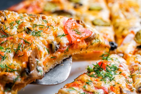 Slice of Delicious fresh hot Pizza with mushrooms.の写真素材