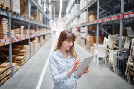 beautiful young furniture store store worker stock taking.の写真素材