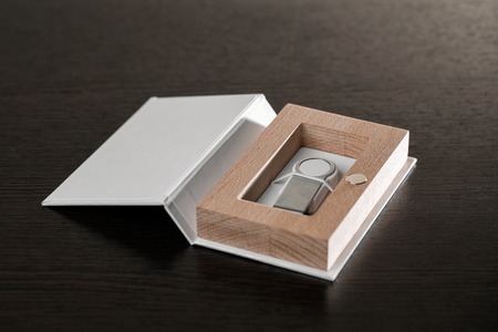 Packaging for USB drives. Handmade box. Wooden boxes on dark background.の写真素材