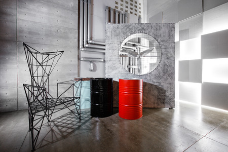 concrete wall interior decor, rough metal chair and barrel.