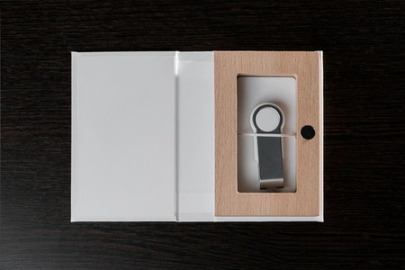 Packaging for USB drives. Handmade box. Wooden boxes on dark background.の写真素材