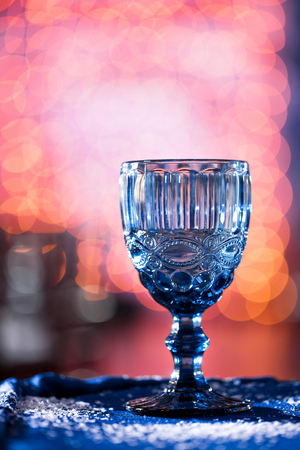 close-up of glass with copyspace and abstract lights backgroundの写真素材