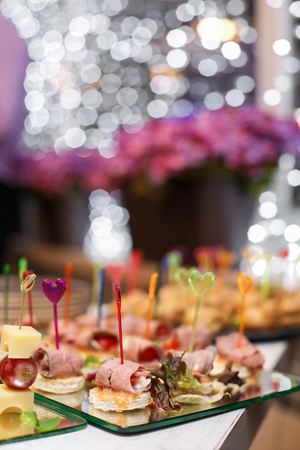 Appetizer of meat chicken, beef and bread are on wooden skewers.の写真素材