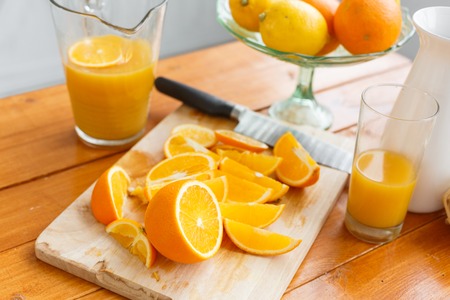 sliced oranges on a wooden cutting board. Healthy and tasty breakfast
