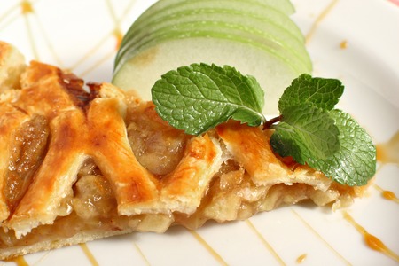 Viennese Apple strudel with vanilla ice cream and mint on a plate.の写真素材
