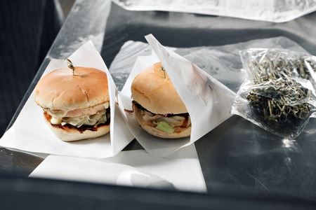 Delicious burgers with beef, tomato, cheese and lettuce. cooked on the grill assembled.の写真素材