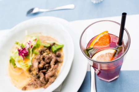 Roasted meat and vegetables. goulash and potato gratin in sauce. selective focus on the filling close-up.の写真素材