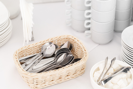 teaspoons closeup. Group of empty coffee cups. White cup for service tea or coffee in breakfast or buffet and seminar event.の写真素材