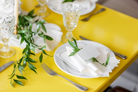 Candles and goblets on a decorated wedding table. selective focusの写真素材