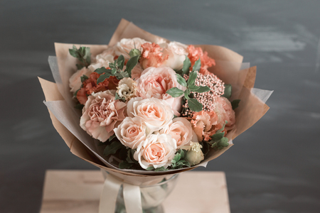 Bouquet in kraft paper. A simple bouquet of flowers and greensの写真素材
