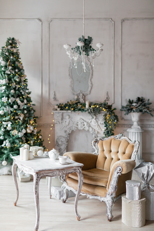 Christmas room with decorated wooden chair and tableの写真素材