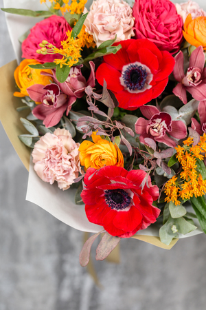 colorful background of flowers. the work of the florist at a flower shopの写真素材