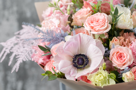 beautiful luxury bouquet of mixed flowers in vase . the work of the florist at a flower shop. copy spaceの写真素材