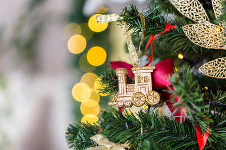 Christmas toy train and garland on the fir treeの写真素材