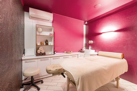 Massage room interior design in wellness and spa center. Dim lightingの写真素材