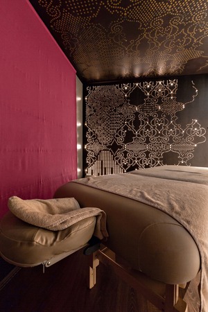 Massage room interior design in wellness and spa center. Dim lightingの写真素材