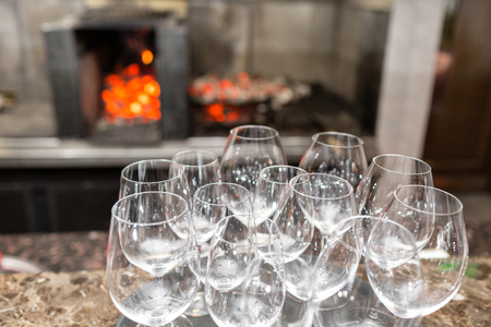 Empty glasses wine in restaurant. Glass water. A tray of wine glasses at a wedding receptionの写真素材