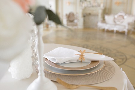 Close-up layout of the festive table. decorated table and chairs for a festive dinner. Luxury decor...
