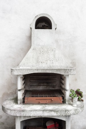 Smoky antique brick oven outdoor with ashes inside. Old garden heater. grill usable for BBQ. patio Vienna, Austriaの写真素材
