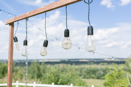 outdoor cafe decorations with lights and garlandsの写真素材