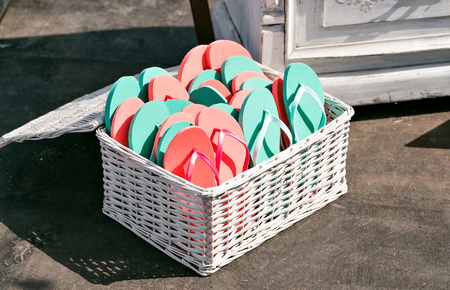 many sandal have many color. Schists pink and green in a basketの写真素材