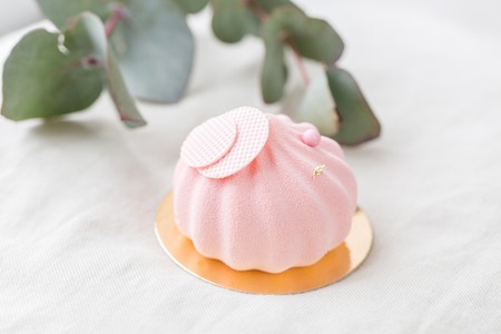 Pastel pink cake on white table. Little dessert served with tea or coffee. wallpaper, Horizontal photoの写真素材