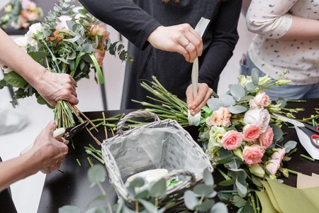 Master class on making bouquets. Spring bouquet. Learning flower arranging, making beautiful bouquets with your own handsの写真素材