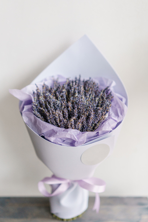 beautiful bouquet lavender on table . dried flowers lilac color. placed in a paper bagの写真素材