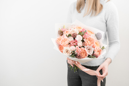 bouquet of beautiful flowers in woman's hands.の写真素材