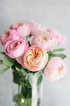 English garden peonies roses, David Austin. Multi color pink flower bud, floral background photo. Lovely flowers in glass vase. Beautiful summer bouquet. Floral composition, daylight. Wallpaperの写真素材