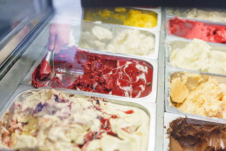 Flavors various ice cream in Rome, Italy. Italian gelateria. Assortment of colorful gelato on cafe showcase.の写真素材