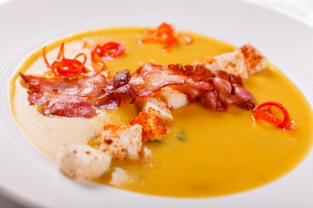 Traditional Spanish cold soup, with bread sticks and bacon chips. Corn Spanishwith bacon. chowderの写真素材