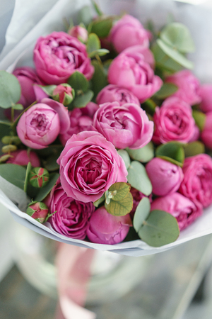 Rose Misty Bubbles. Bouquet flowers of pink roses in metal vase. Shabby chic home decor. florist at a flower shop.の写真素材