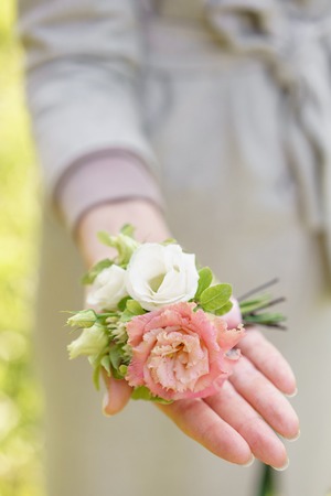 boutonniere. Young girl holding a beautiful spring Flowers. flower arrangement with lisianthus....