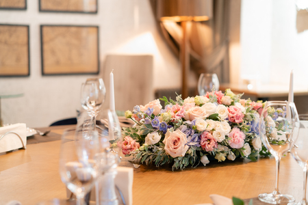 beautiful flower arrangement. Wedding Banquet or gala dinner. The chairs and table for guests, served with cutlery and crockery.の写真素材