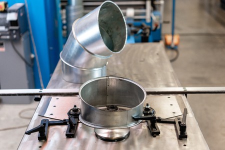 production rolling tool, electric machine. the production of ventilation and gutters. Tool and bending equipment for sheet metal. manufacture or a demonstration stand in the storeの写真素材