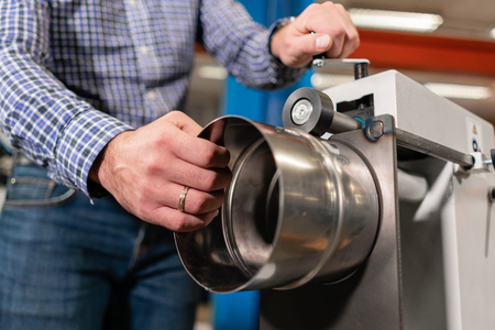 production rolling tool, electric machine. the production of ventilation and gutters. Tool and bending equipment for sheet metal. manufacture or a demonstration stand in the storeの写真素材