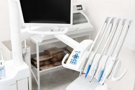 Stomatological instrument in the dentists clinic. Dental work in clinic. Operation, tooth replacement. Medicine, health, stomatology concept. Office where dentist conducts inspection and concludes.の写真素材