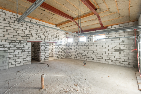 Large garage for two cars with of the gate. overhaul and reconstruction. Working process of warming inside part of roof. House or apartment is under construction, remodeling, renovation, restoration.の写真素材