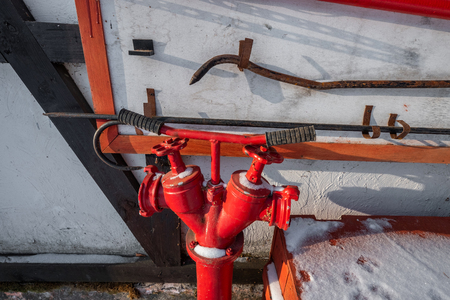 Red fire hydrant surrounded in snow. fire-fighting devices in the forestの写真素材