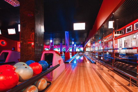 Russia, Nizhny Novgorod - may 26, 2014: Sormovsky Cinema and Entertainment center. Modern interior of bright and colorful bowling club. View of the bowling rolling lanesのeditorial素材