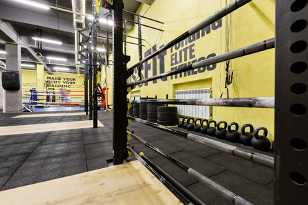 Russia, Nizhny Novgorod - January 30, 2017: Interior of the gym for fitness workout. Cross fit training. Barbells kettlebells bars and weightlifting gearのeditorial素材