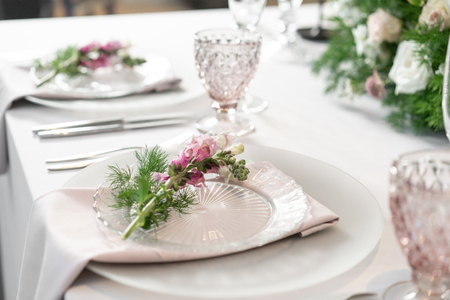Floral decoration for wedding ceremony romance dining. Wedding banquet , festive decor. Bouquet from spring and summer flowers. Table layout. Restaurant interior. Concept of service and catering.の写真素材