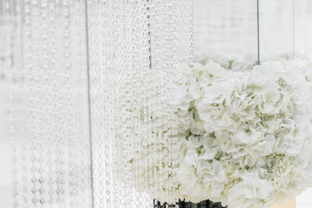 Crystal decorations for the wedding ceremony, luxurious decor. Beautiful arch decorated with chains with transparent beadsの写真素材